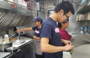 Employees prepping the food truck