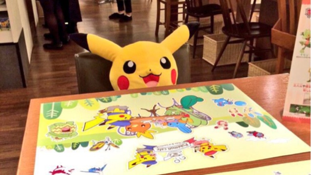 Interior of Pokemon Cafe with a stuffed Pikachu seated at the table