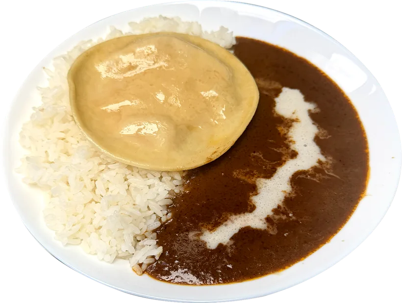 Okamoto Curry over rice topped with a pumpkin ricotta ravioli and coconut crème